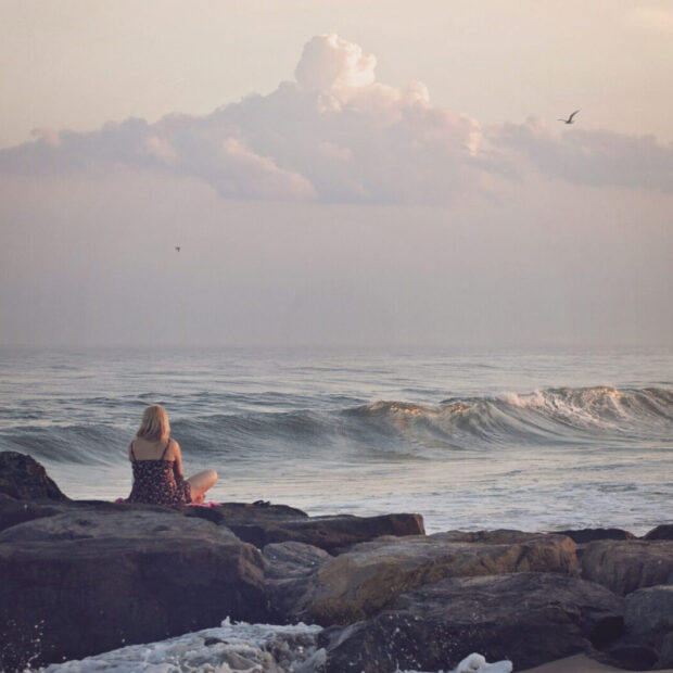 Canva - Woman Contemplating by the Beach