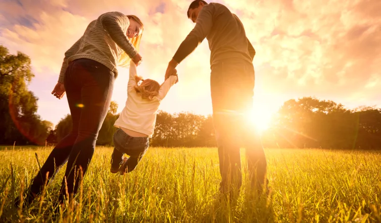 Parents who have undergone their Pre-Adoption Psychological Evaluation with their adopted child: a happy family.