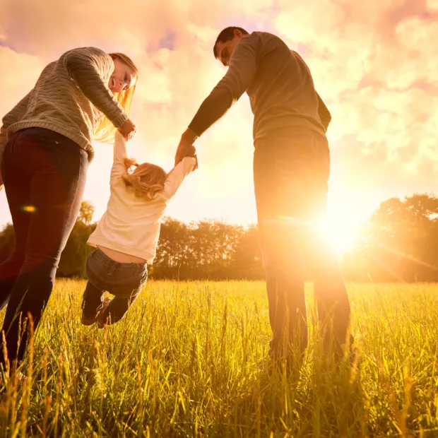 Parents who have undergone their Pre-Adoption Psychological Evaluation with their adopted child: a happy family.