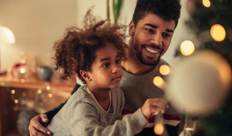 Child with Autism Spectrum Disorder playing with father