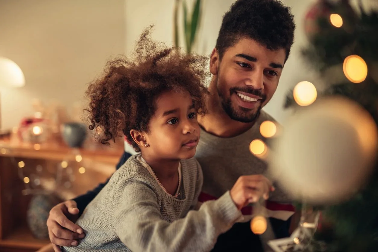 Child with Autism Spectrum Disorder playing with father