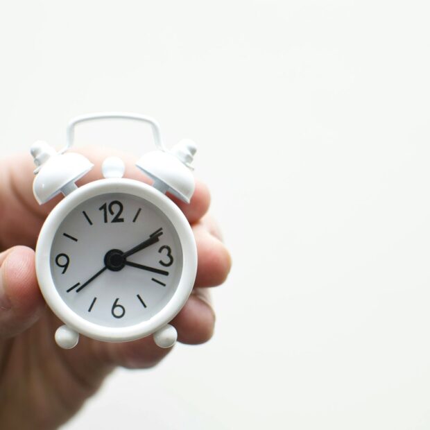 Analog clock on a table marking the short window of a panic attack peak.